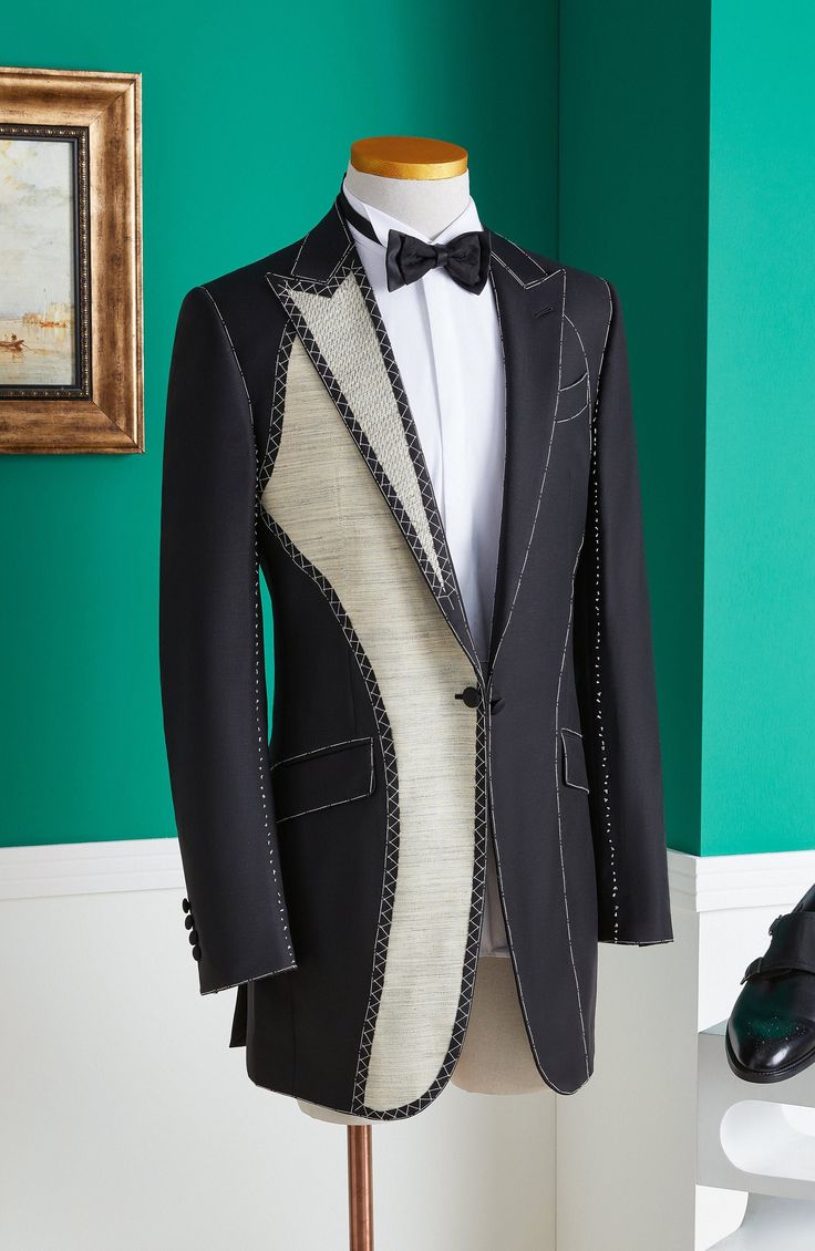 Tailor measuring fine fabric with a tape measure